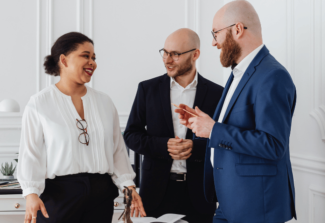 Professionals discussing a project during a strategy session Professionals discussing a project during a strategy session